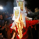 Protesters burning an effigy of Vijayan in New Delhi on Jan. 03.